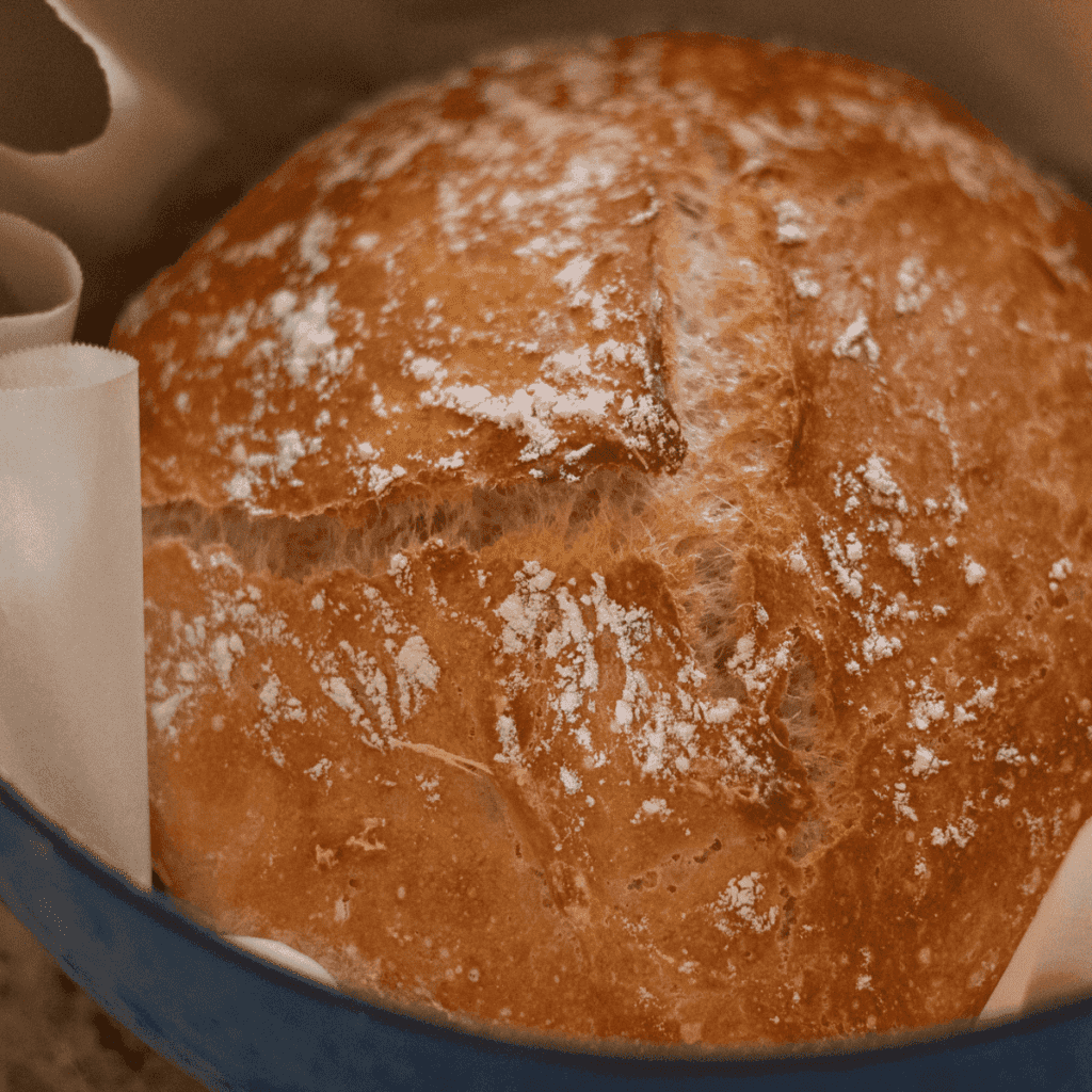 Loaf of crusty bread in a Dutch oven