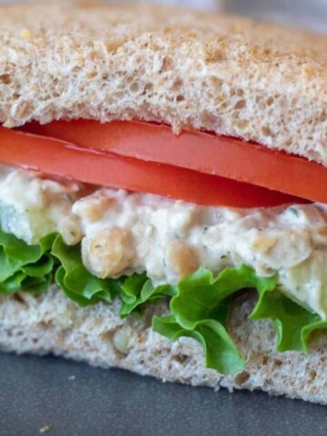 Creamy chickpea salad sandwich with lettuce and tomato