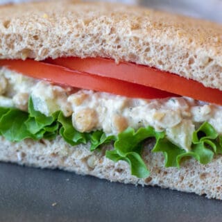 chickpea salad sandwich with lettuce and tomato