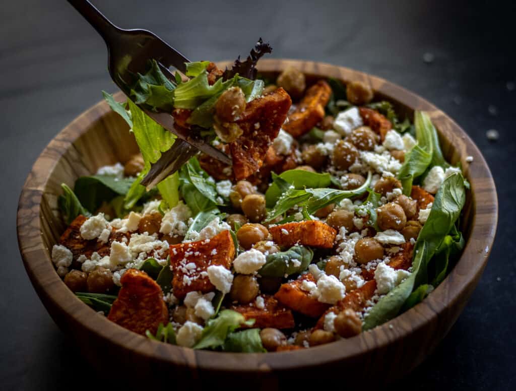 Bowl of roasted sweet potato and chickpea salad.
