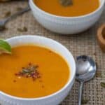 Two bowls of pumpkin soup