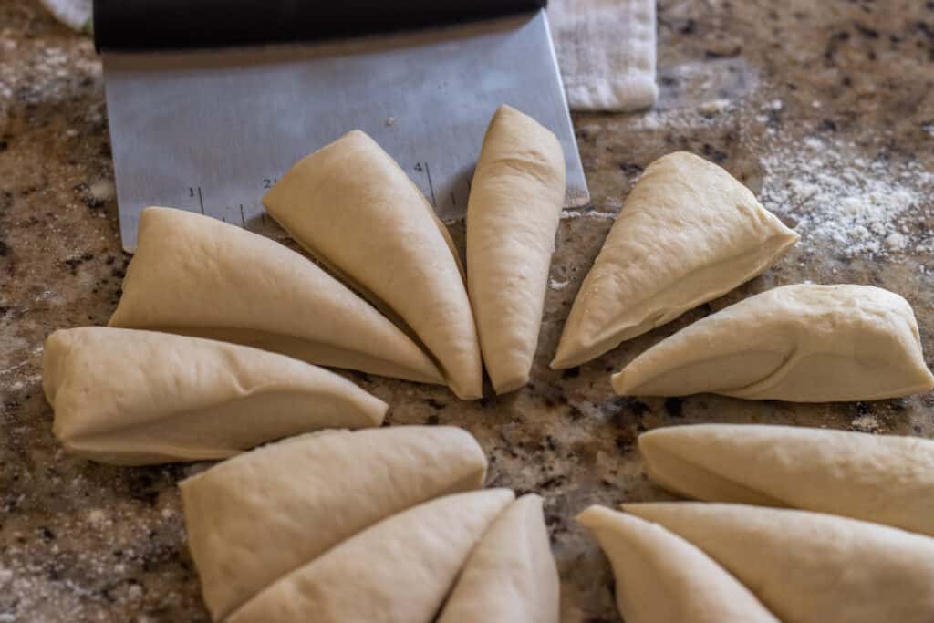Raw flatbread dough cut into equal pieces