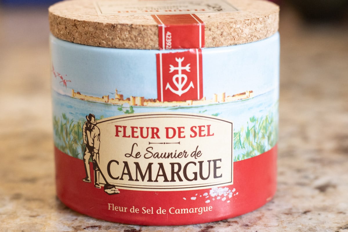 A container of Fleur de Del sea salt.