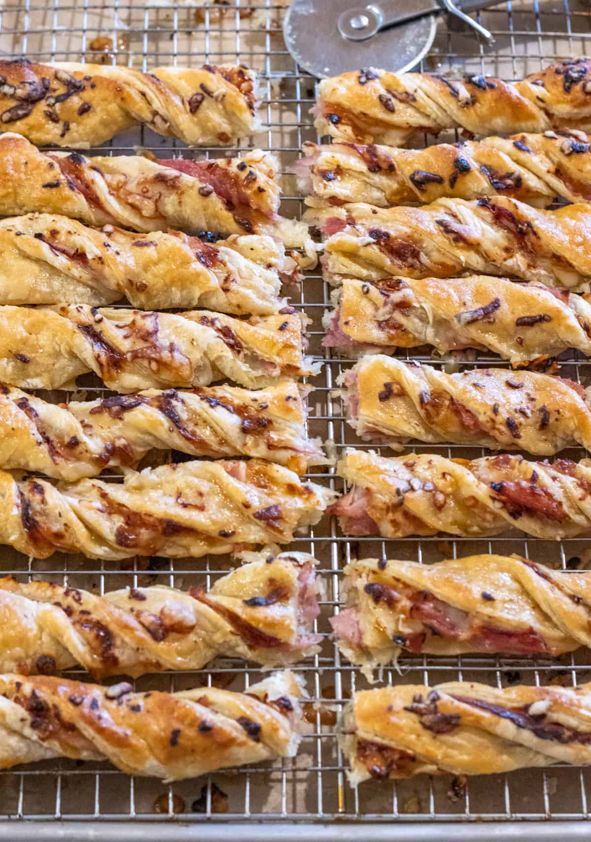 Ham and cheese puff pastry twists cut in half.