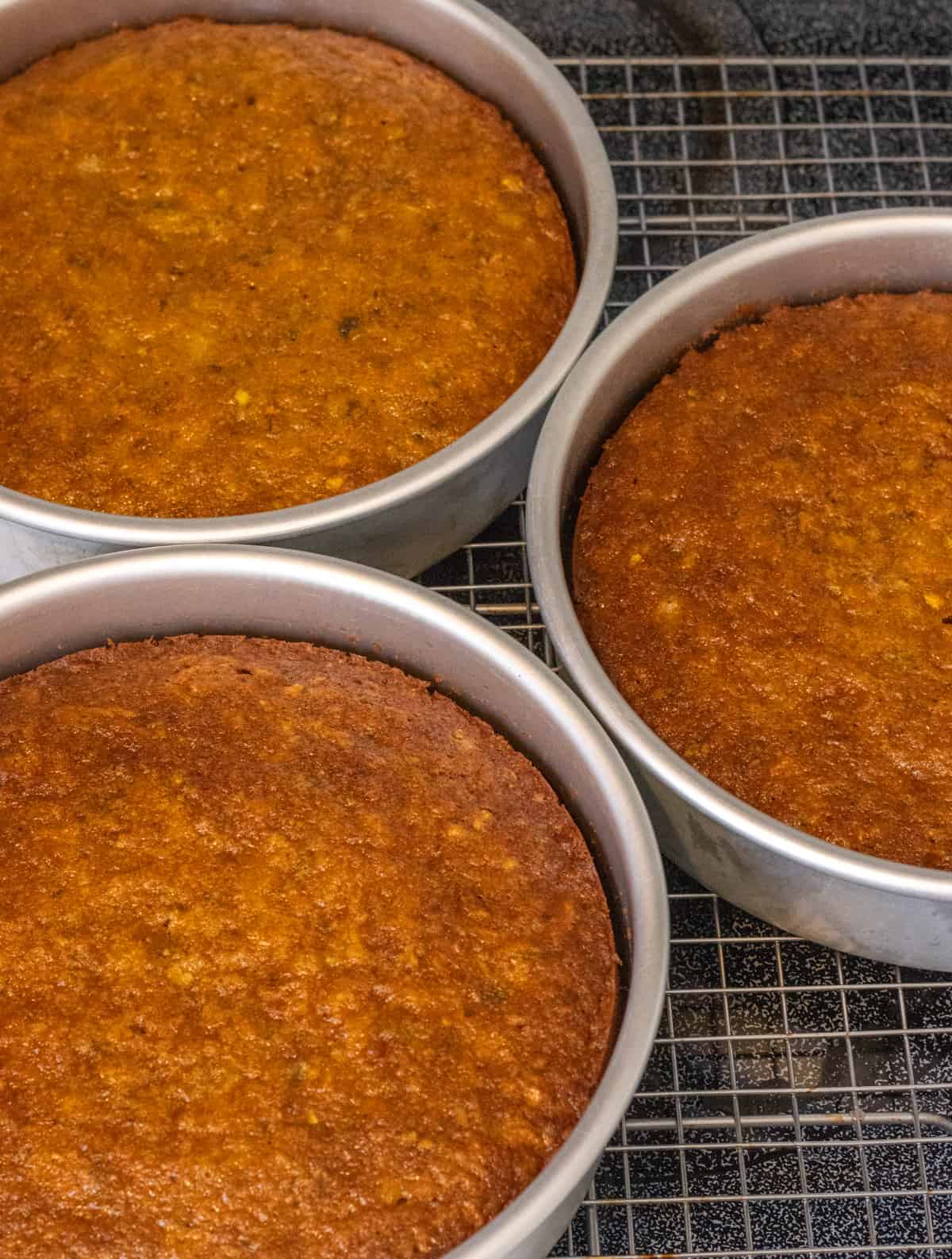 Carrot cakes cooling in their pans.
