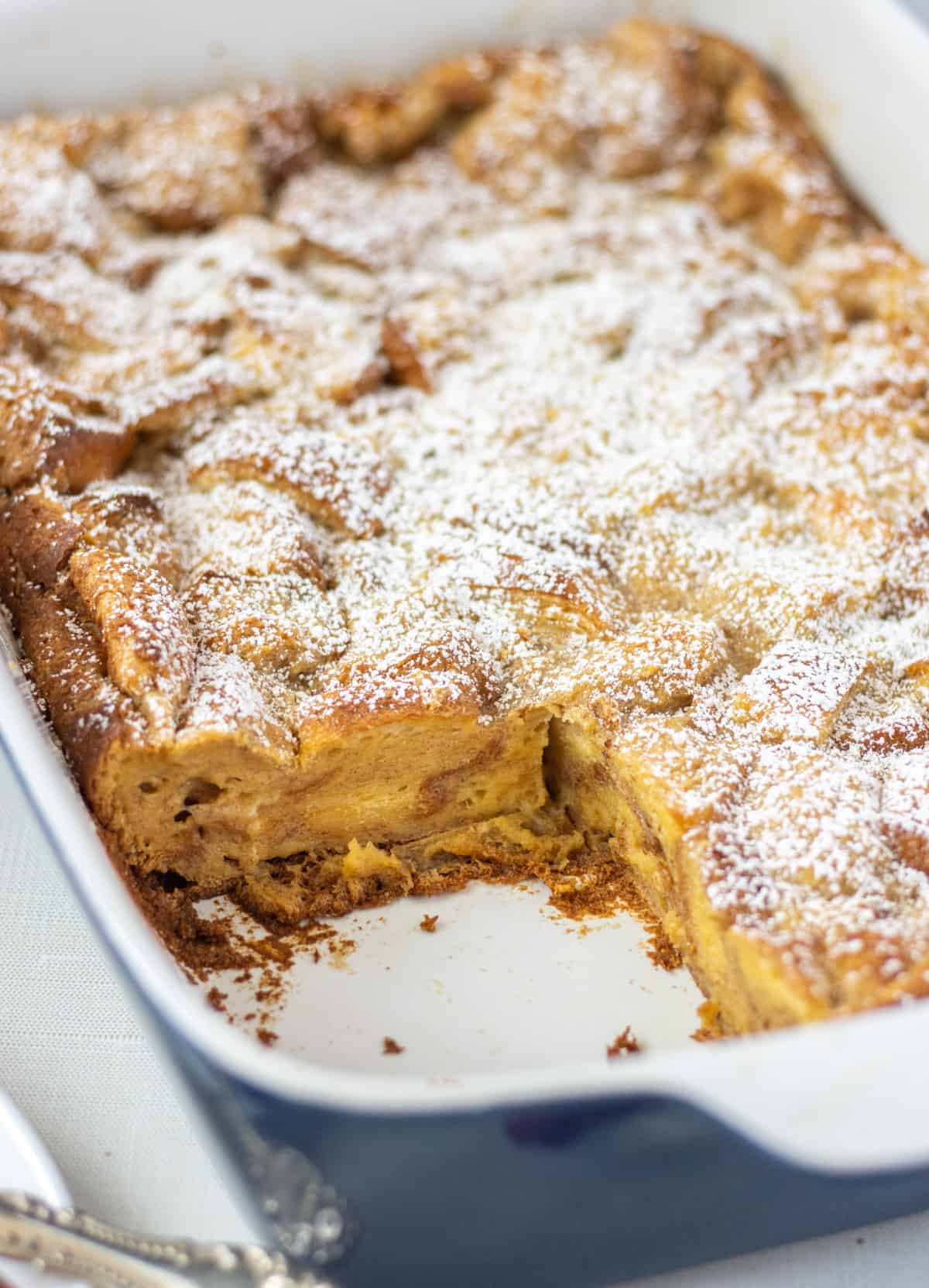 Side shot of French toast casserole with a slice cut out.