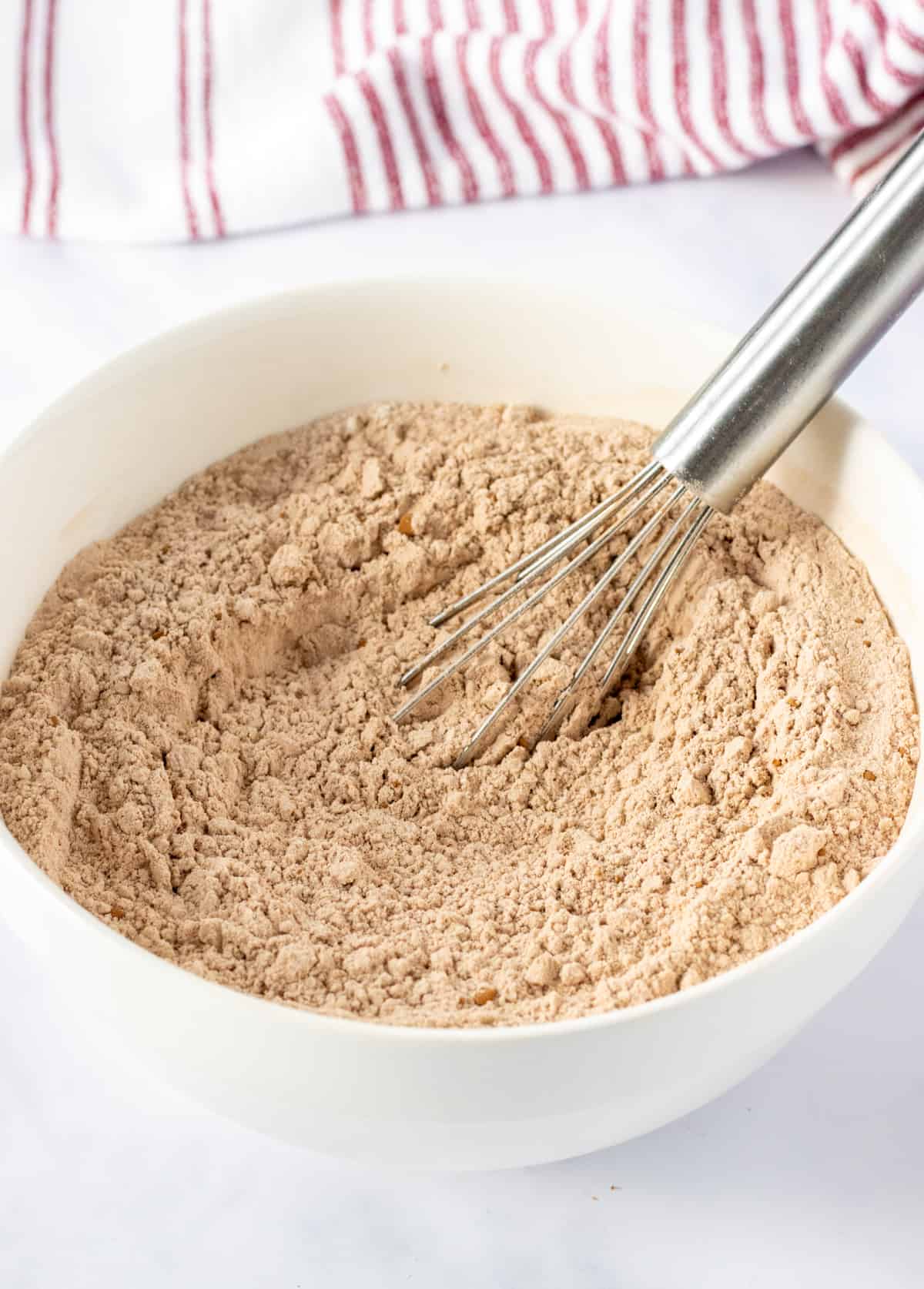 Dry ingredients whisked together in a bowl.