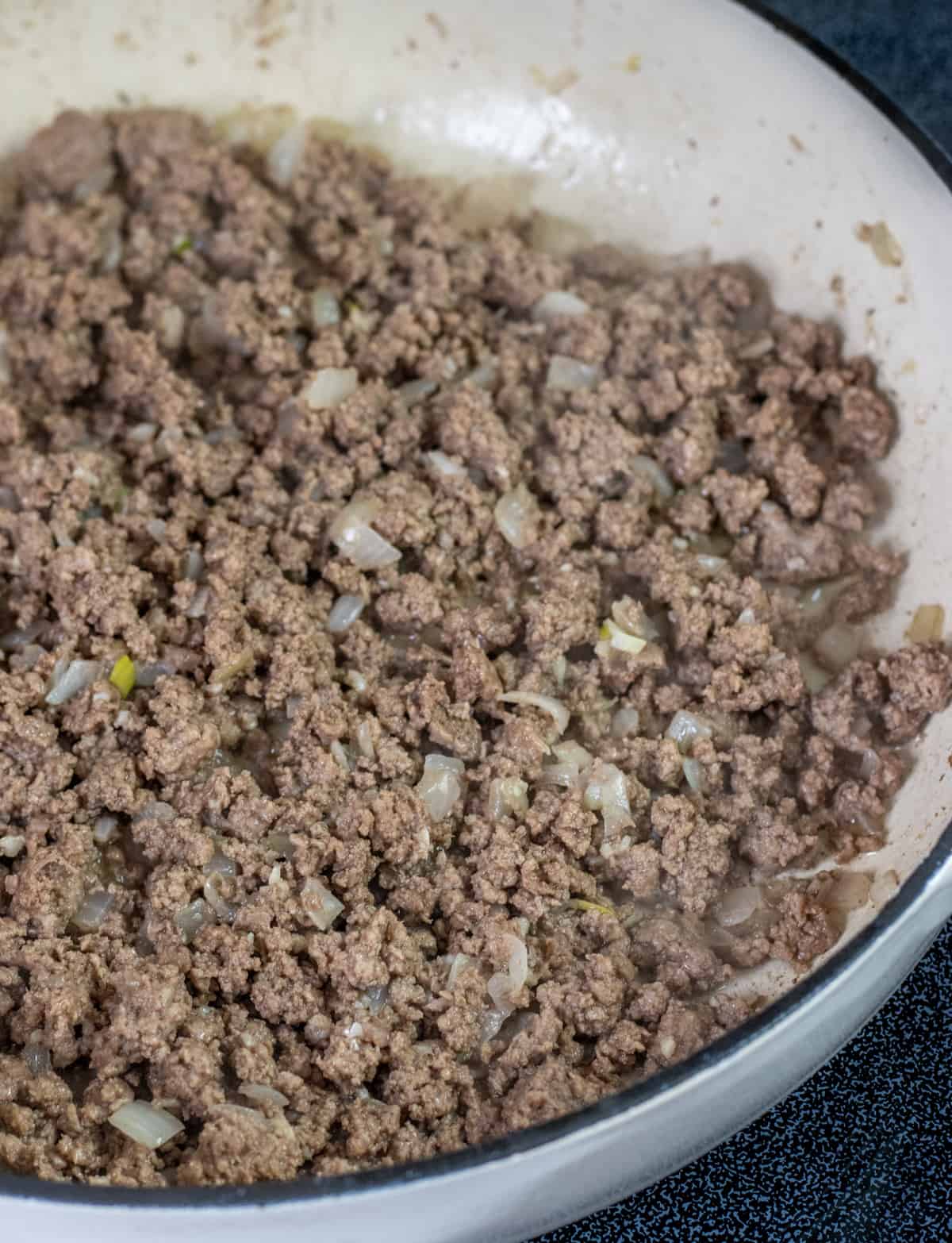 Cooked ground beef in a casserole dish.