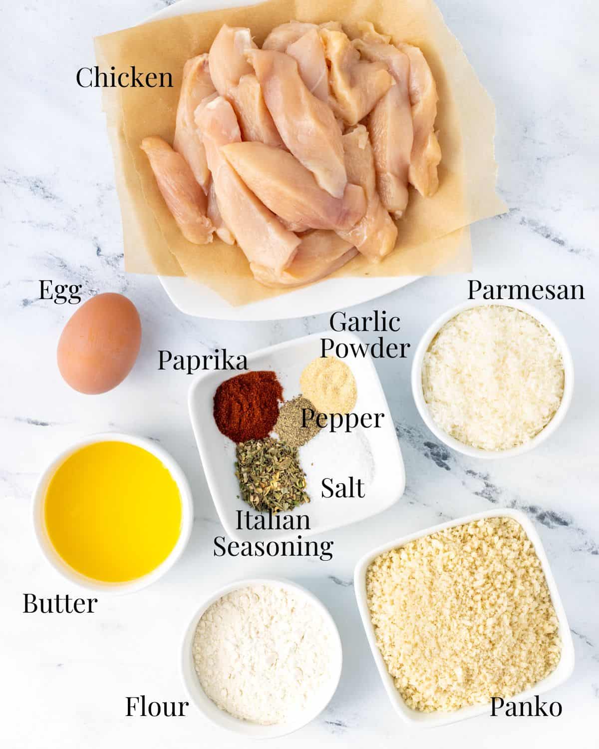 Ingredients for panko crusted chicken with labels.