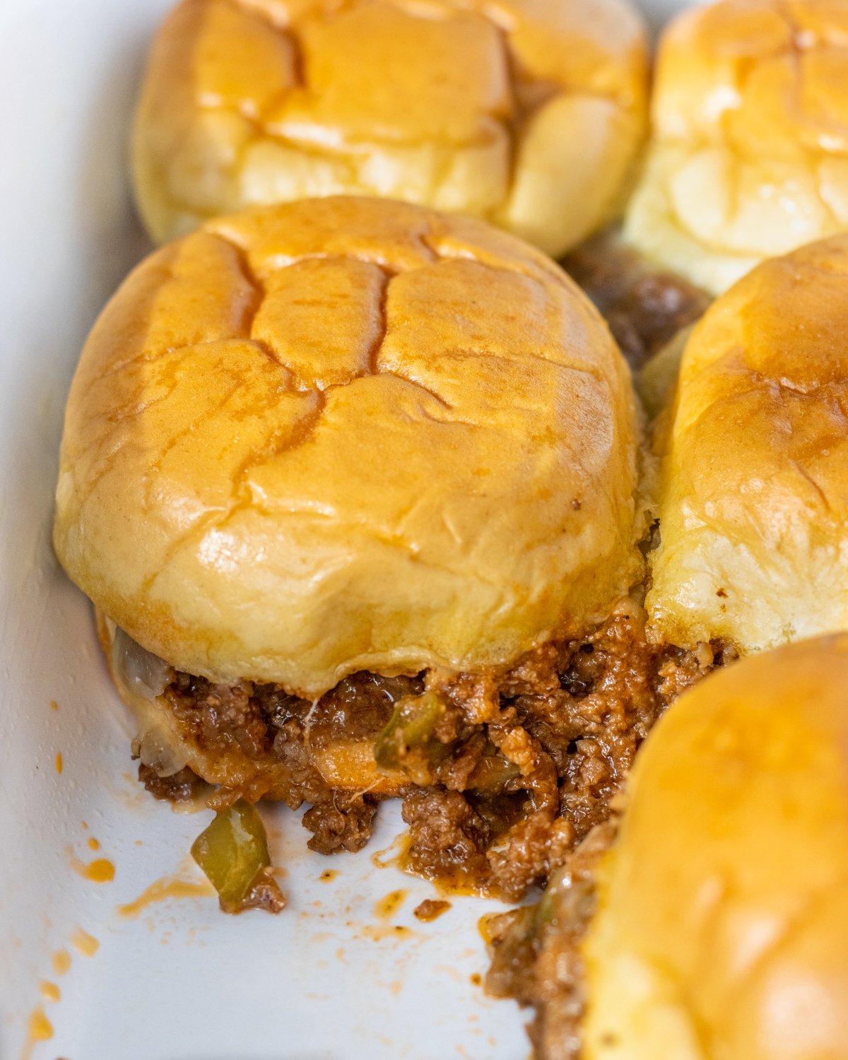 Sloppy joe sliders in a baking dish.