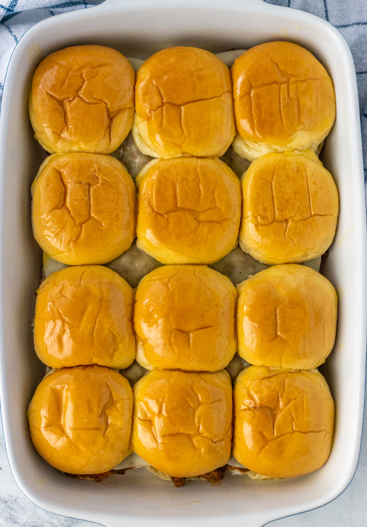 Sloppy Joe sliders in a baking dish.