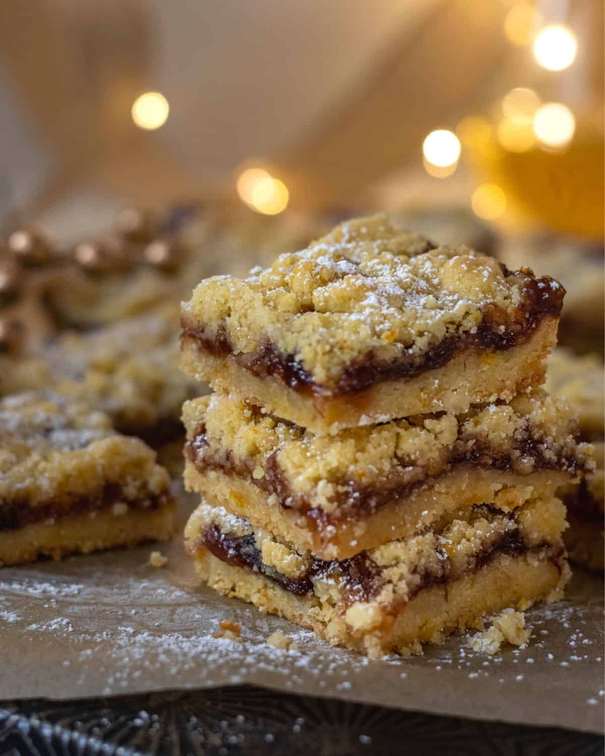Stack of plum bars with twinkle lights in the back.