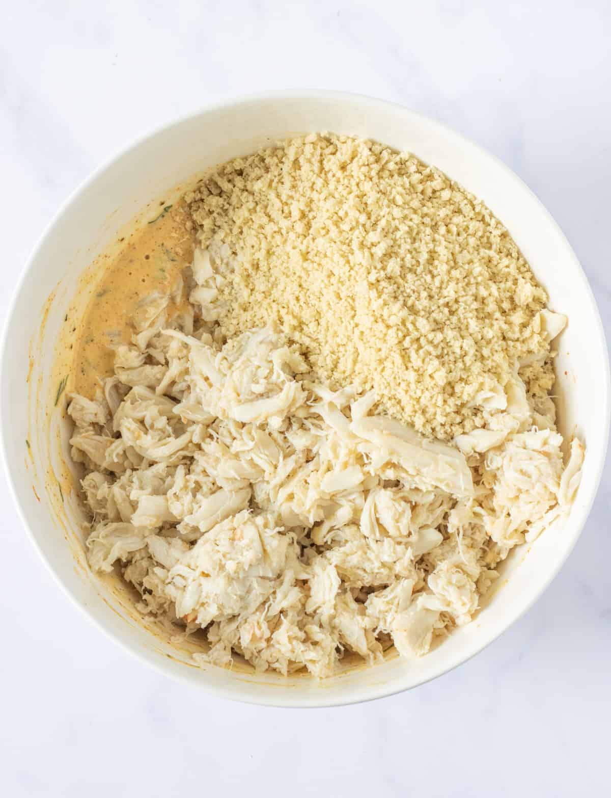 Crab meat and panko crumbs added to the wet mixture.