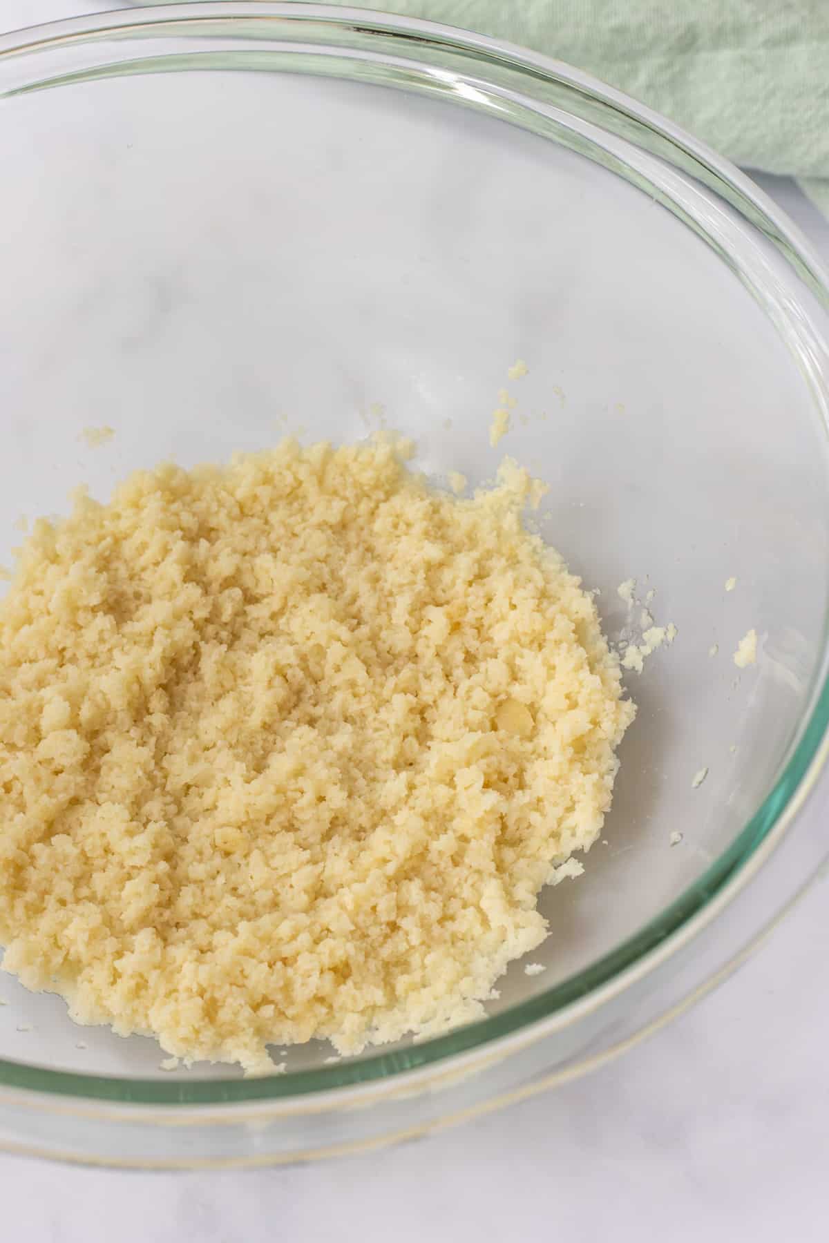 Panko hydrated with water in a bowl.