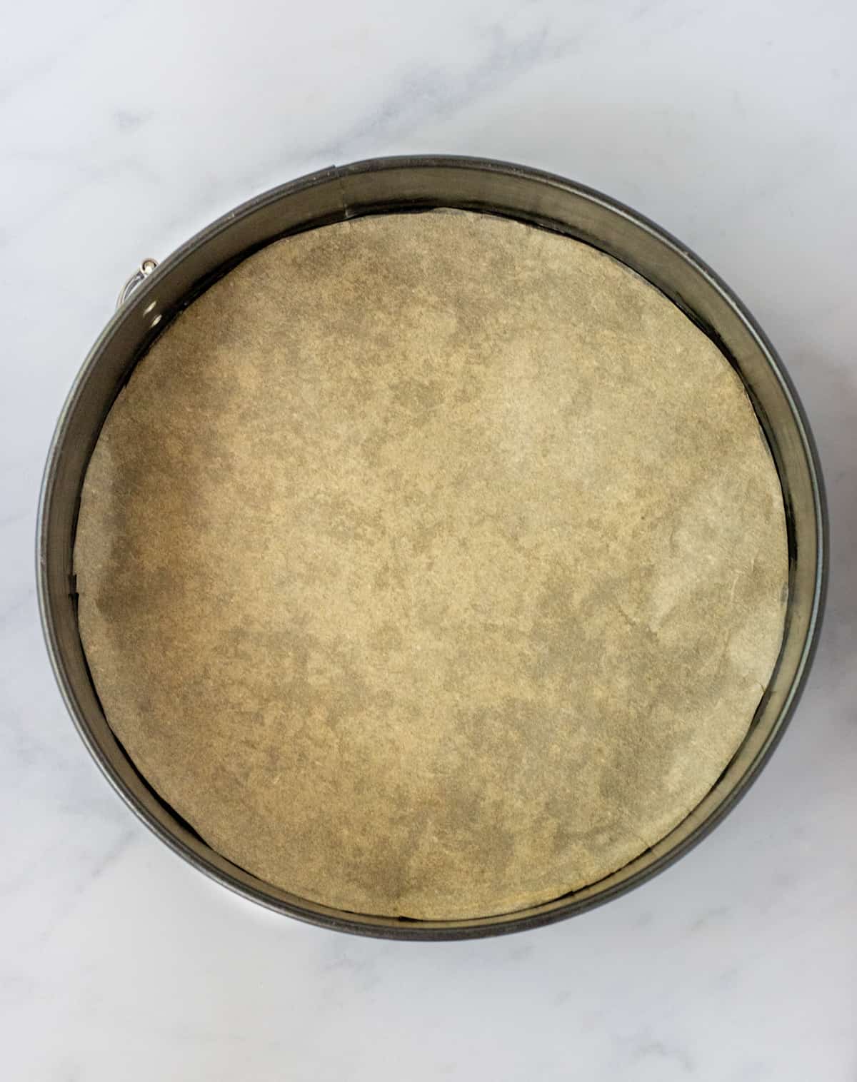 Parchment-lined springform pan.