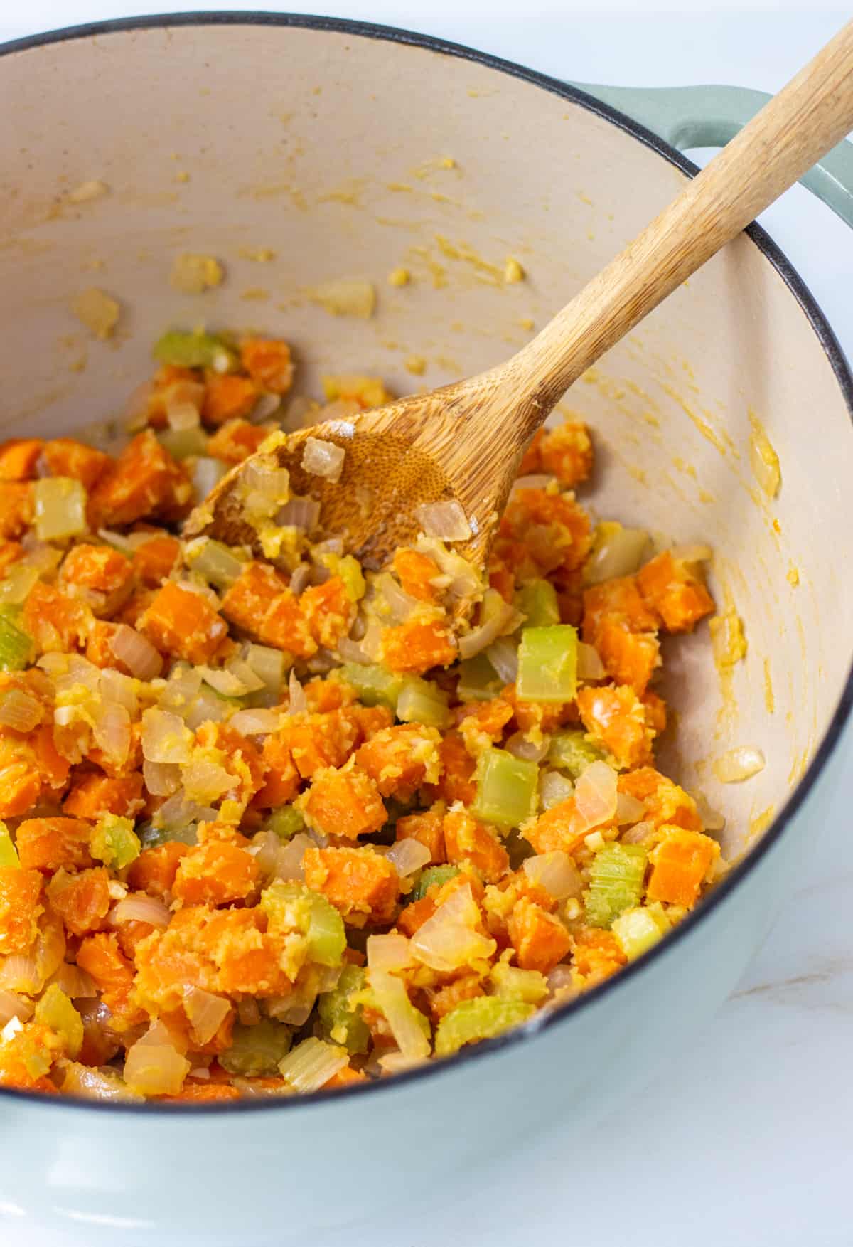 Diced potatoes, carrots, and celery coated in flour.