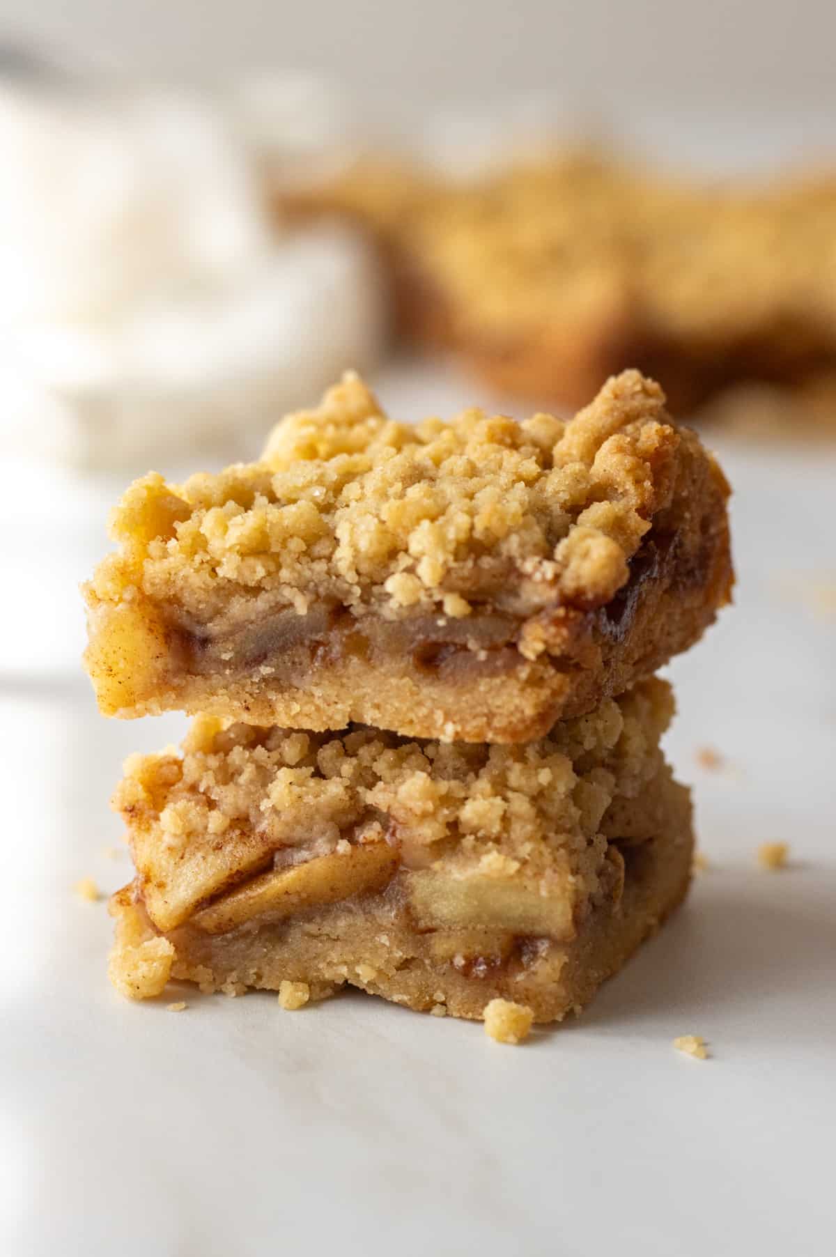 Two apple bars stacked with more bars in the background.