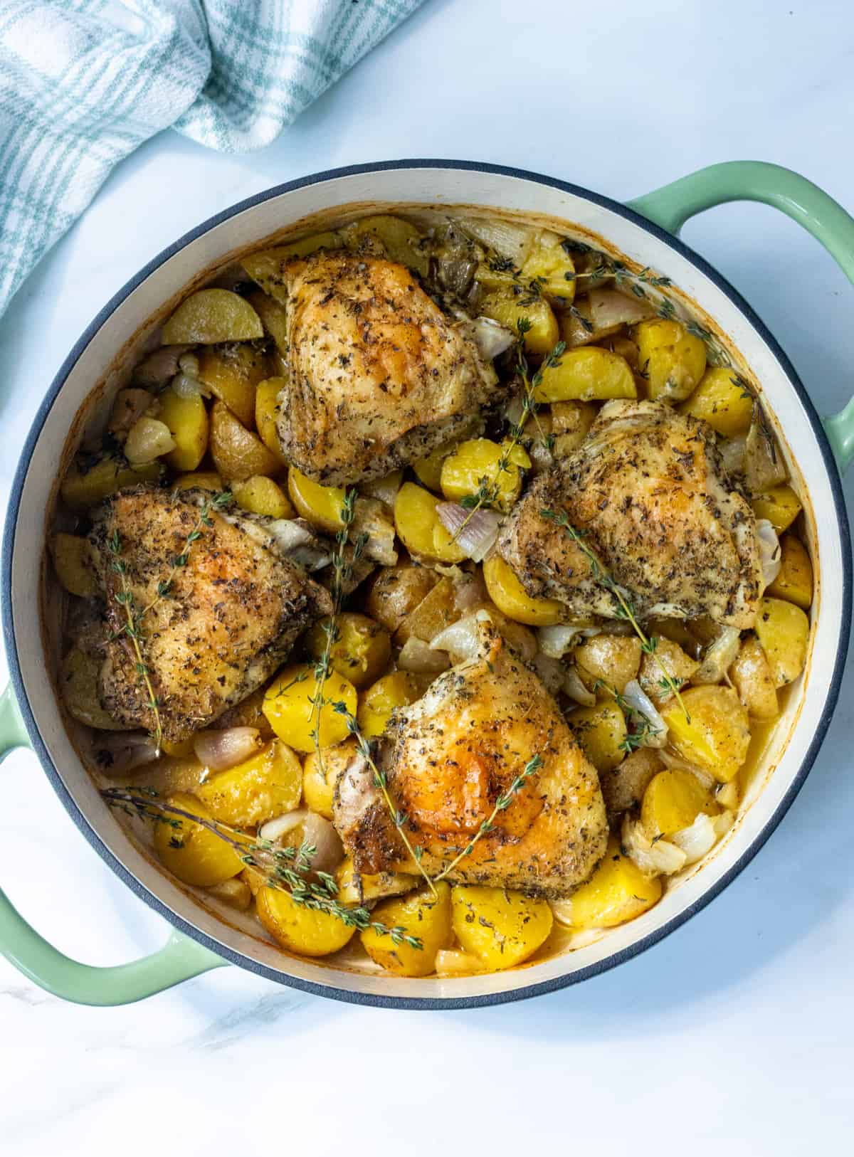 Herbs de Provence chicken and potatoes in a large skillet.