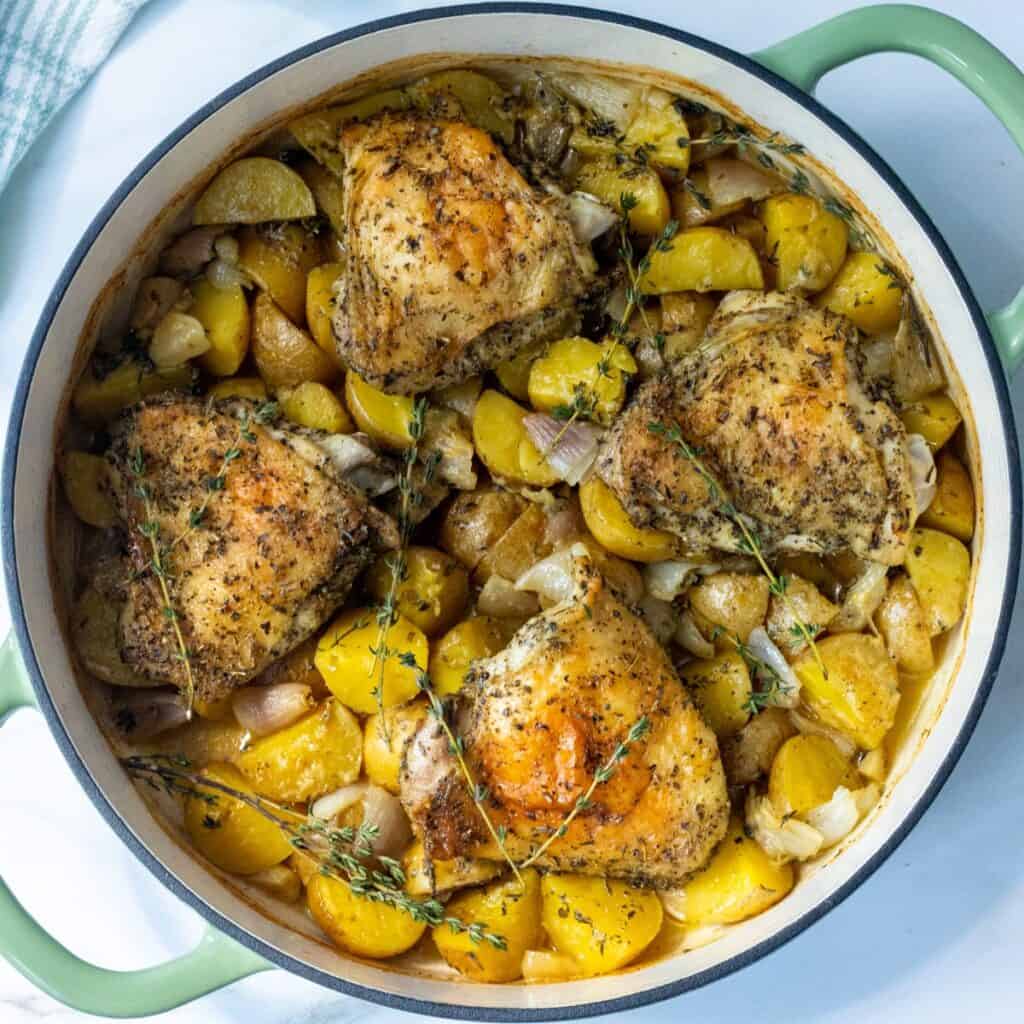 Herbs de Provence chicken and potatoes in a large skillet.