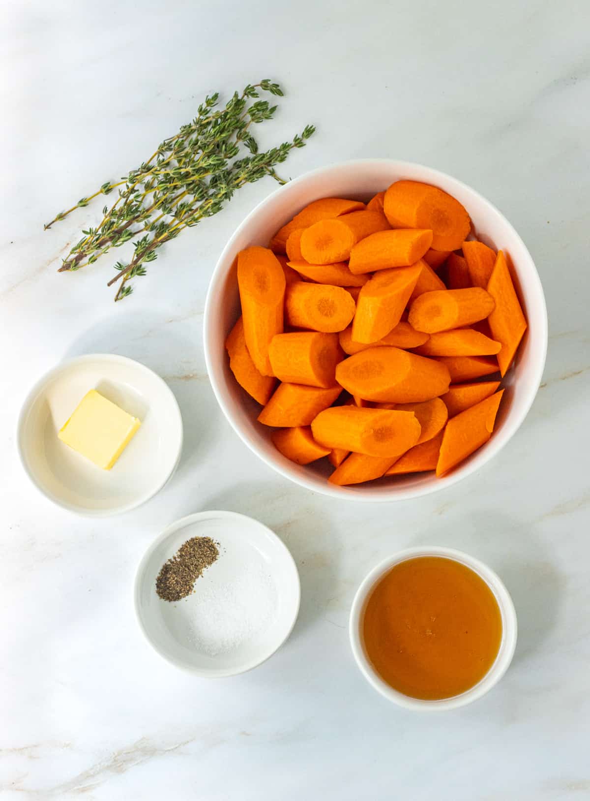 Ingredients for honey thyme roasted carrots.
