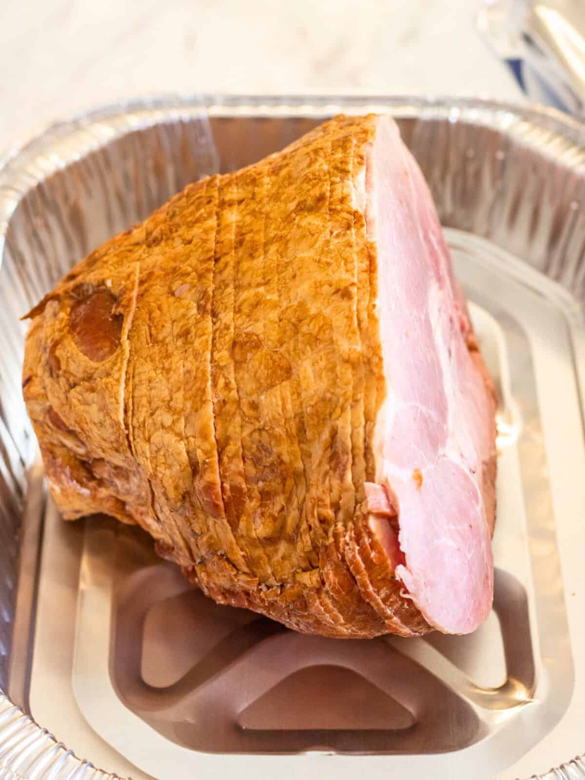 Spiral cut ham in a foil tin.