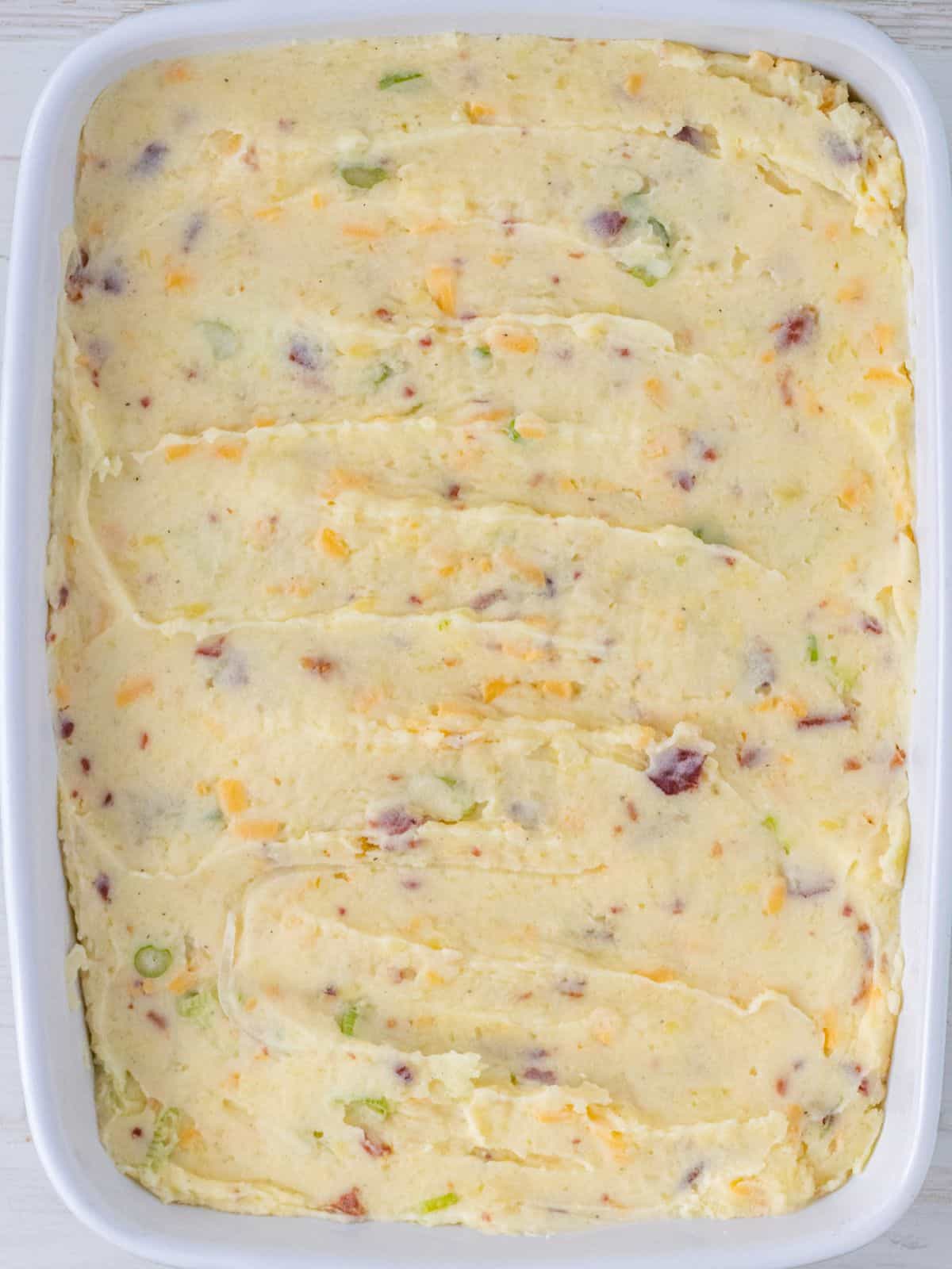 Loaded mashed potato filling in a baking dish.