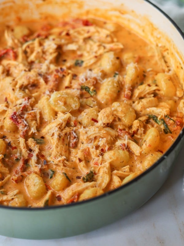 Sun dried tomato chicken gnocchi in a skillet.