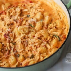 Sun dried tomato chicken gnocchi in a pot.